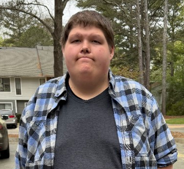 Kris, a Finding Harmony resident, achieving stability through the Wheels-to-Work initiative